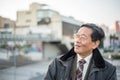 Japanese senior old man outdoors smiling and happy portrait Royalty Free Stock Photo