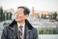 Japanese senior old man outdoors smiling and happy portrait Royalty Free Stock Photo