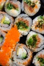Japanese set of multi-colored sushi rolls vertical photo shot on top view with different mixed various pieces very close-up Royalty Free Stock Photo