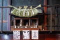 Shinto shrine in private home with shimenawa (rope) and shide (white paper) streamers. Japan