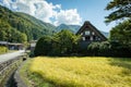 Japanese Shirakawago village during October in autumn fall foliage season. Shirakawa traditional house on triangle roof with a bac Royalty Free Stock Photo