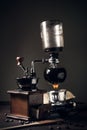 Japanese siphon coffee maker and coffee grinder on old kitchen t Royalty Free Stock Photo