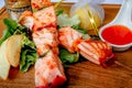 Japanese skewers on a wooden salmon skewer. Served with a salad of tomatoes and fresh herbs. Royalty Free Stock Photo