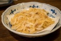 Japanese snack food. A plate of small shrimps fried.