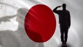 Japanese soldier silhouette saluting against national flag, brave sergeant