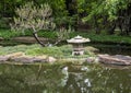 Japanese stone garden lantern in the Japanese Garden of the Fort Worth Botanic Garden, Texas. Royalty Free Stock Photo