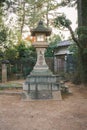 The Japanese Stone Lantern in Kitano Tenmangu Shrine in Kyoto, Japan Royalty Free Stock Photo
