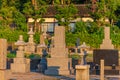 Japanese stone pedestal lanterns, or tachidoro in Japanese, and traditional tombstones. Royalty Free Stock Photo