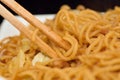 Japanese Street Food Fried Yakisoba Noodles with wooden Chopsticks Royalty Free Stock Photo