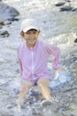 Japanese student girl playing in the river Royalty Free Stock Photo