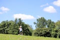 Japanese student girl playing soccer on the grass Royalty Free Stock Photo