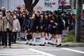 Japanese student waiting at the crossroad