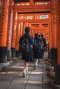 Japanese students walking along the inari in Fushimi Inari-taisha, Kyoto, Japan Royalty Free Stock Photo