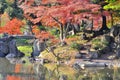 A japanese style garden and lake in autumn Royalty Free Stock Photo