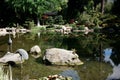 Japanese Style Garden With Pond and Stone Sculpture