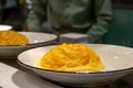 A Japanese-style omelet rice being made