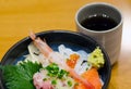 Japanese style raw seafood rice with tea Royalty Free Stock Photo