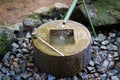 Japanese style traditional bamboo fountain at Ryoan-ji temple in Kyoto, Japan Royalty Free Stock Photo