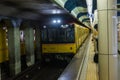 Japanese Subway train is coming in Track with waited passenger