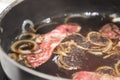 Japanese sukiyaki beef boiled in black soup iron pot