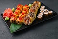 Japanese sushi assorted on a black stone plate Royalty Free Stock Photo