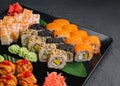 Japanese sushi assorted on a black stone plate Royalty Free Stock Photo