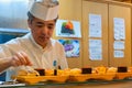 Japanese sushi chef prepares dishes of traditional sushi Royalty Free Stock Photo