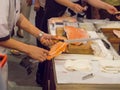 Japanese Sushi chef shows ` how to debone a salmon fillet ` at Seafood festival , Seacon Square shopping center.