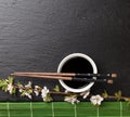 Japanese sushi chopsticks, soy sauce bowl and sakura blossom Royalty Free Stock Photo