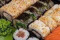 Japanese sushi food. Maki ands rolls with tuna, salmon, shrimp, crab and avocado. Top view of assorted sushi, all you can eat menu Royalty Free Stock Photo