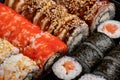 Japanese sushi food. Maki ands rolls with tuna, salmon, shrimp, crab and avocado. Top view of assorted sushi, all you can eat menu Royalty Free Stock Photo