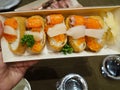 Japanese rice sushi wrap with tofu sheet topping with Hotate shell fresh salmon and egg & x28; Inari sushi& x29;