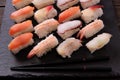 Japanese sushi platter various different with chopsticks black slate background Royalty Free Stock Photo