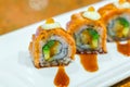 Japanese Sushi rolls with fresh raw salmon on white plate . Royalty Free Stock Photo