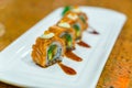 Japanese Sushi rolls with fresh raw salmon on white plate . Royalty Free Stock Photo