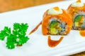 Japanese Sushi rolls with fresh raw salmon on white plate . Royalty Free Stock Photo