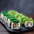 Japanese sushi rolls on wooden tray, close up Royalty Free Stock Photo