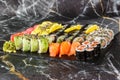 Japanese sushi set. Set of fresh tuna maki , salmon nigiri and dragon sushi rolls served on black plate close-up. Horizontal top Royalty Free Stock Photo