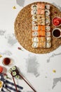 Japanese Sushi - Set of Maki Sushi Roll, Soy Sauce and Ginger over White Texture Background Royalty Free Stock Photo