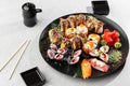 Japanese sushi set. Set of fresh tuna maki , salmon nigiri and dragon sushi rolls served on black plate close-up. Horizontal top Royalty Free Stock Photo