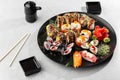 Japanese sushi set. Set of fresh tuna maki , salmon nigiri and dragon sushi rolls served on black plate close-up. Horizontal top Royalty Free Stock Photo