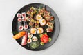 Japanese sushi set. Set of fresh tuna maki , salmon nigiri and dragon sushi rolls served on black plate close-up. Horizontal top Royalty Free Stock Photo