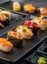 Japanese sushi set in ceramic empty plate dark Placed on the table concrete grunge texture background Royalty Free Stock Photo