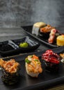 Japanese sushi set in ceramic empty plate dark Placed on the table concrete grunge texture background Royalty Free Stock Photo