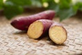 Japanese sweet potato on weave basket and leaf background