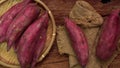 Japanese sweet potatoes or Beni Haruka on wooden background.