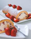 Japanese sweet roll with vanilla cream and strawberries dessert