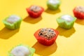 Japanese sweets Mochi in factory packaging on a yellow background. Royalty Free Stock Photo