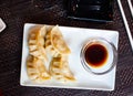 Japanese tasty dumplings gyozas with soy sauce