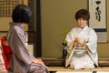 Japanese tea ceremony masters during ceremonial preparation and presentation of powdered green tea matcha Royalty Free Stock Photo